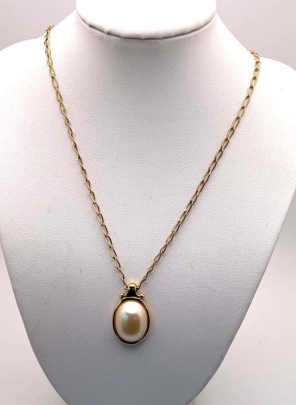 Signed Monet Gold-Plated Necklace With a Bezel-Set Faux Pearl Cabochon Pendant